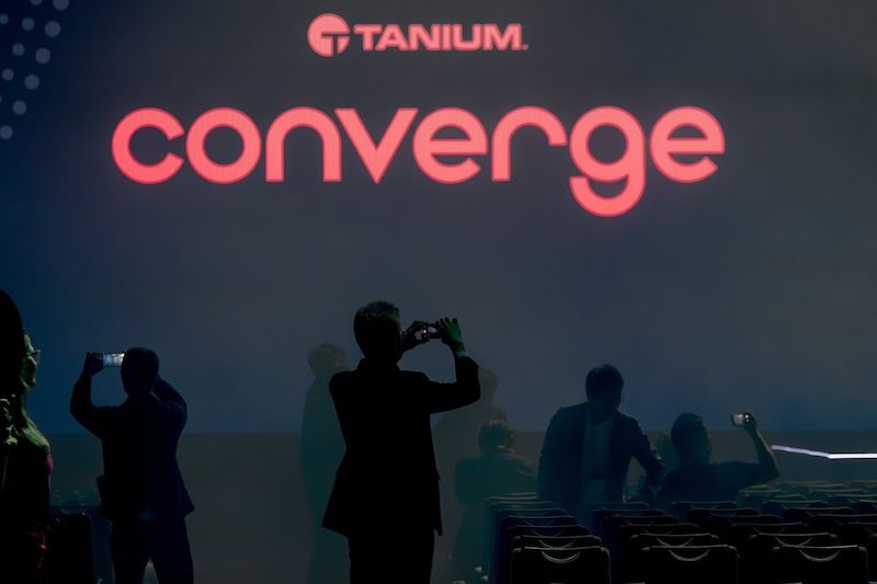 CONVERGE 2024 stage with Tanium logo and attendees
