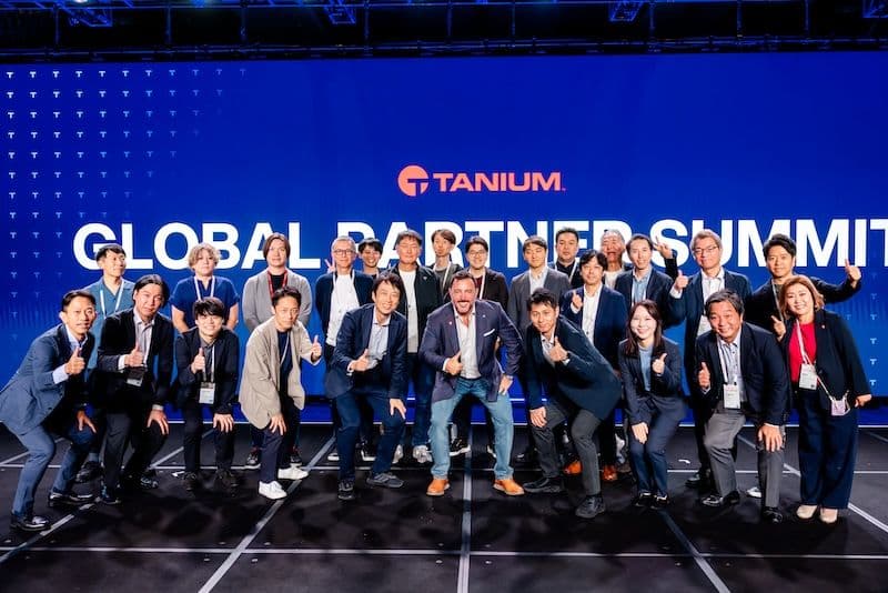 Converge 2025 Tanium SVP of Global Partner Sales Tony Beller and summit attendees