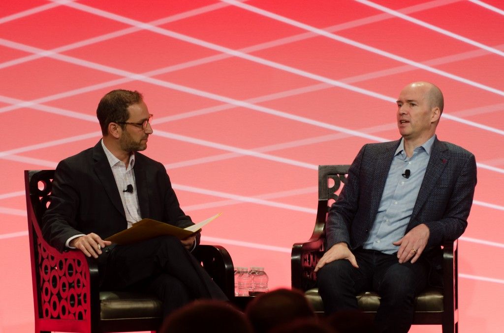 Panel discussion at CONVERGE 2016 with two men in conversation on stage