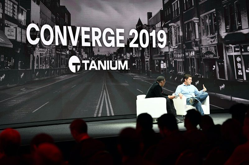 Panel discussion with two speakers at CONVERGE 2019 Tanium conference