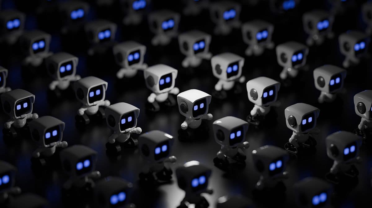 Ranks of cute little robots in dim light.