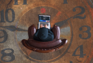 Illustration of hands holding laptop above large clock representing time management