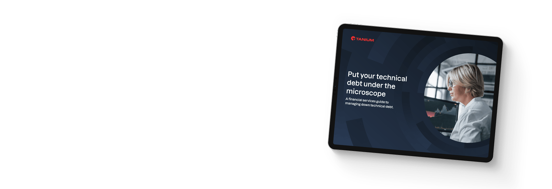 Tablet showing ebook 'A financial services guide to managing down technical debt' with woman at desk