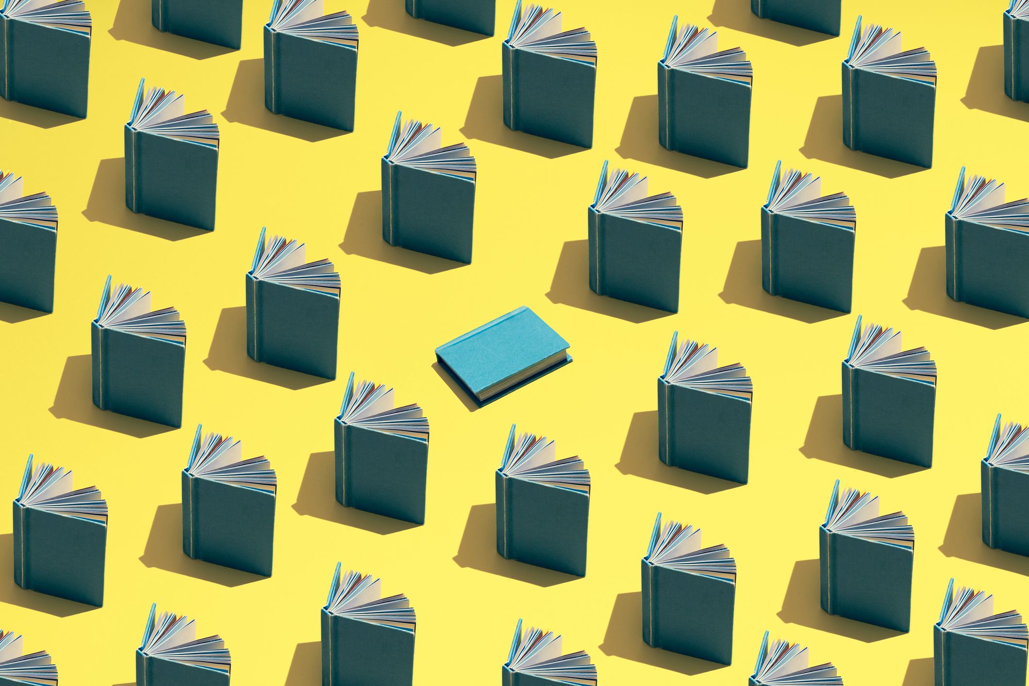 Blog featured image. An illustration of books propped open in rows against a yellow field and one blue book in center.