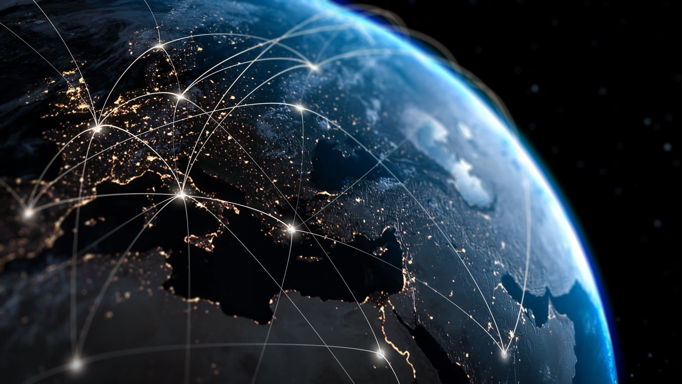 The blue orb of Earth,seen from space, with Europe's urban centers illuminated in gold light.
