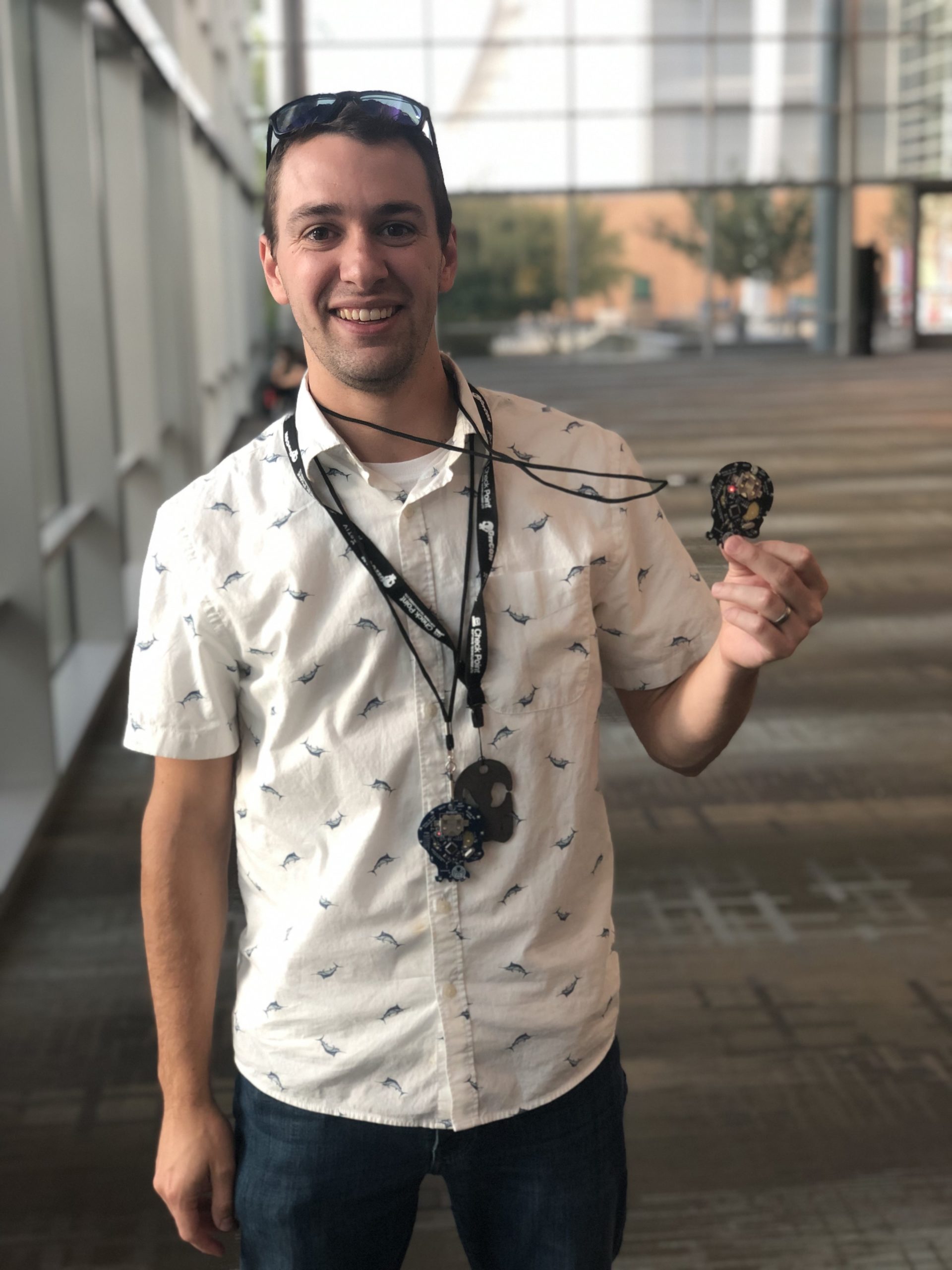 Connor Ivens holding his Black Badge after winning GrrCON which gives him a free conference pass for life.