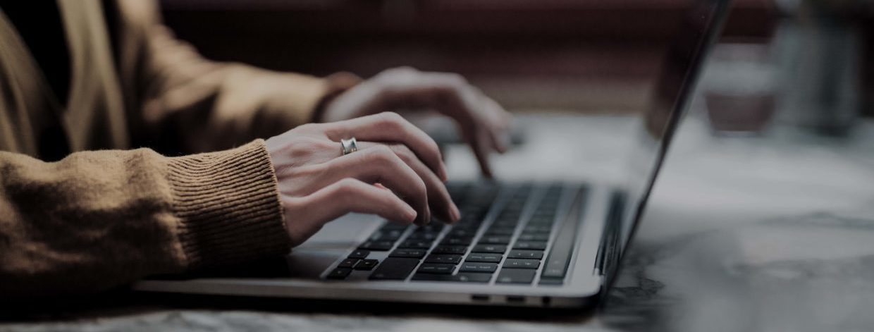 stock image: hands at a laptop