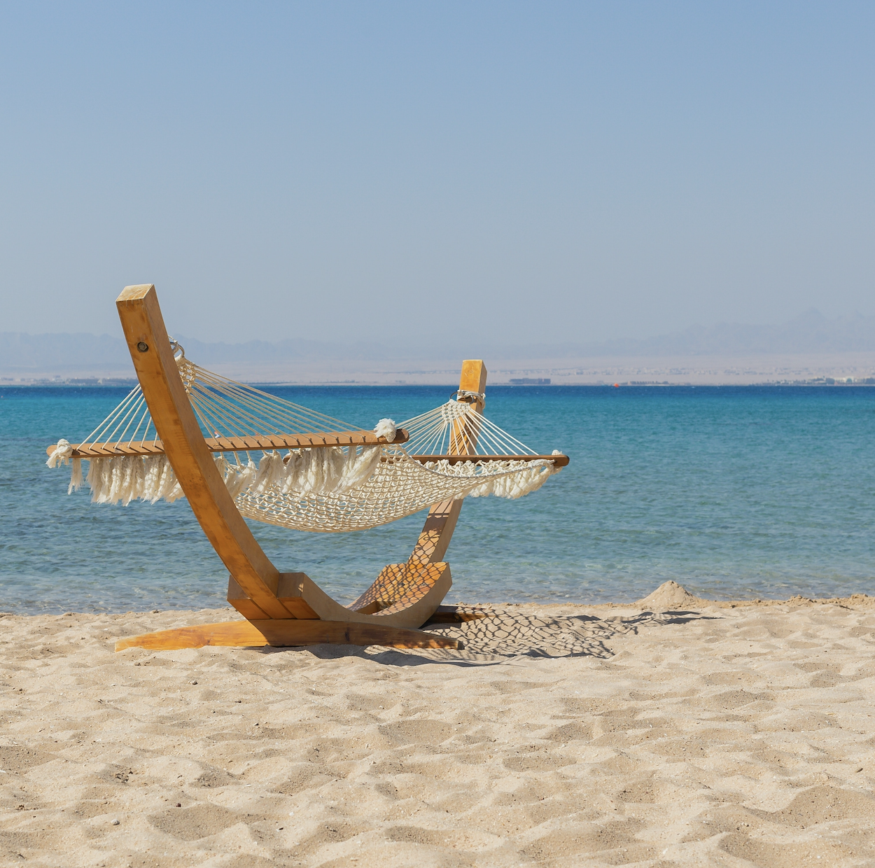 Blog featured image. Picture of a hammock on a beach.