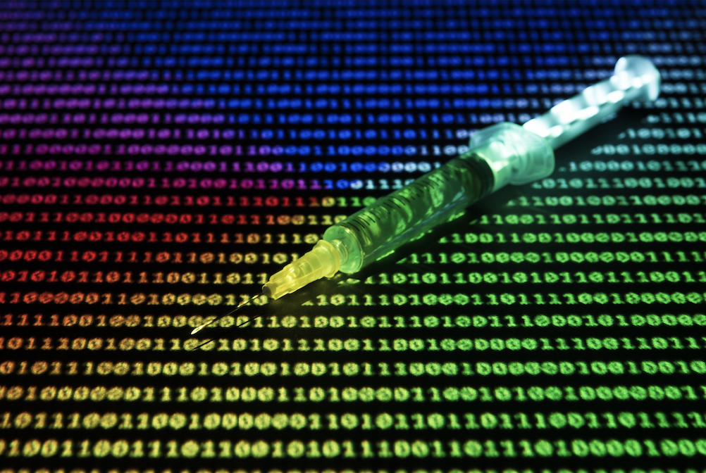 An image of a hypodermic needle sitting atop a spread of neon-bright ones and zeros.