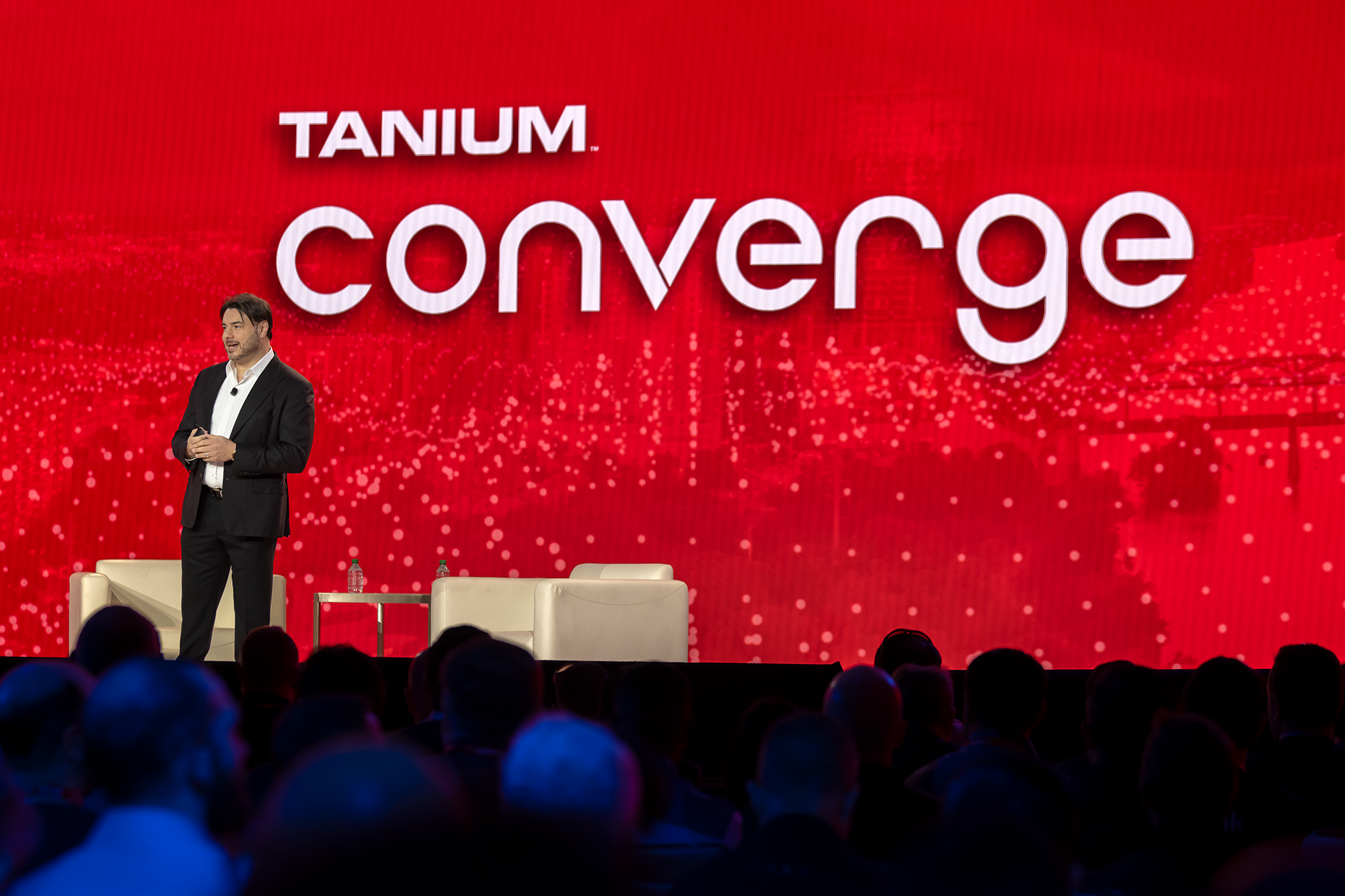 Tanium CMO Steve Daheb presenting on stage at Tanium Converge 2022