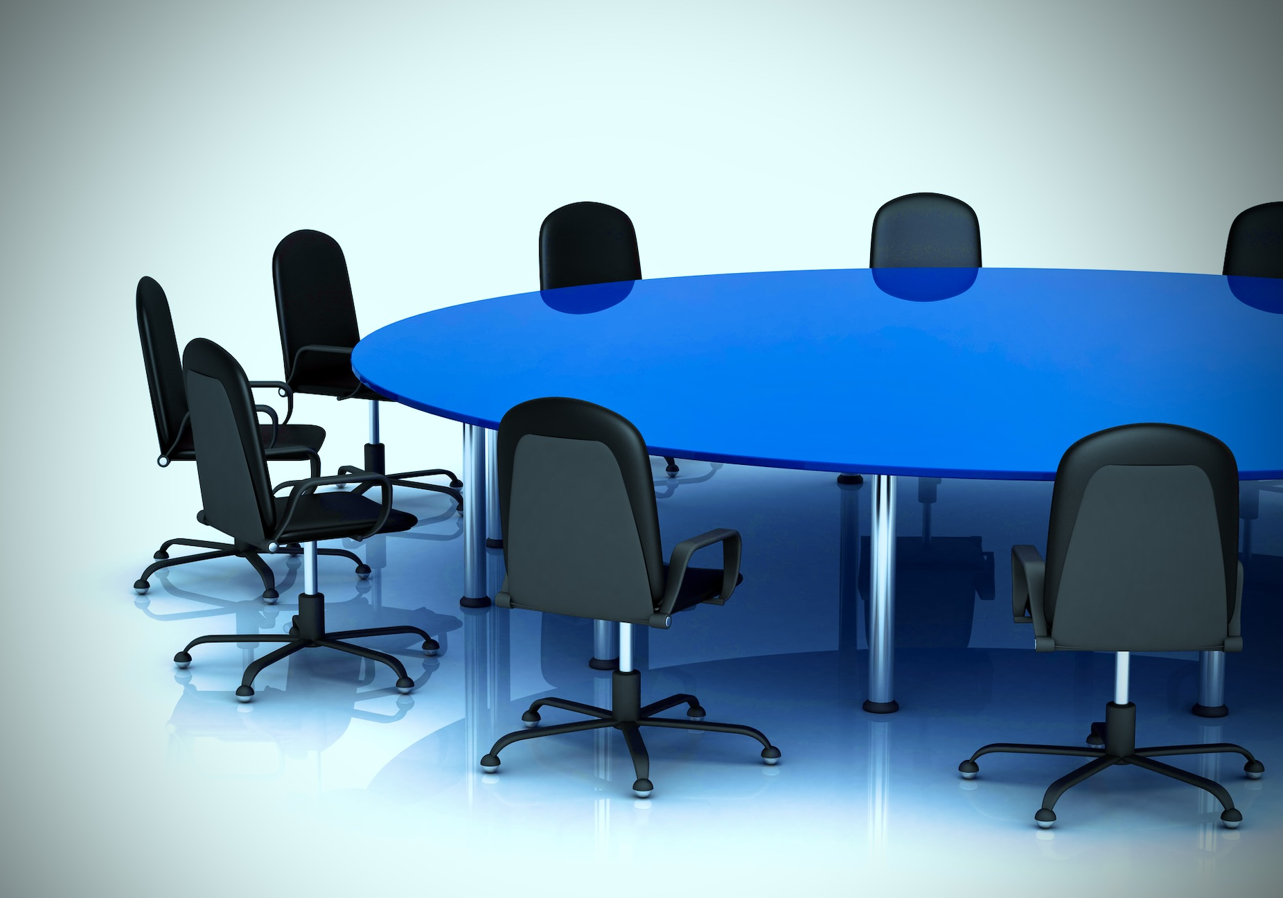 Photo of an oblong bright blue boardroom table surrounded by chairs